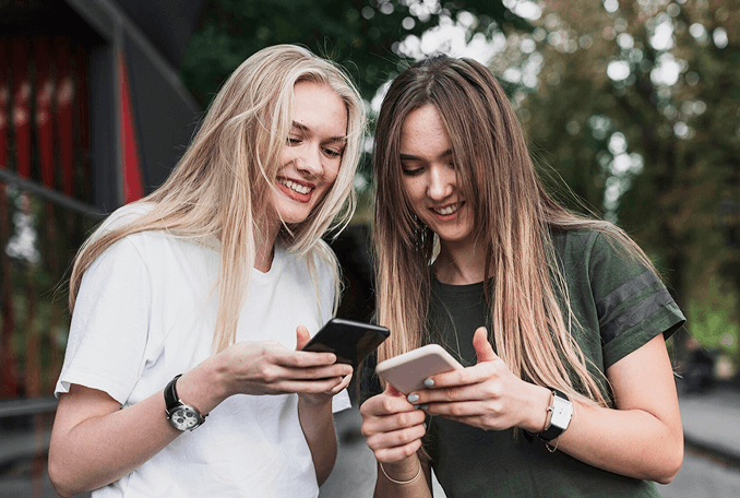 Girls watching to the phones